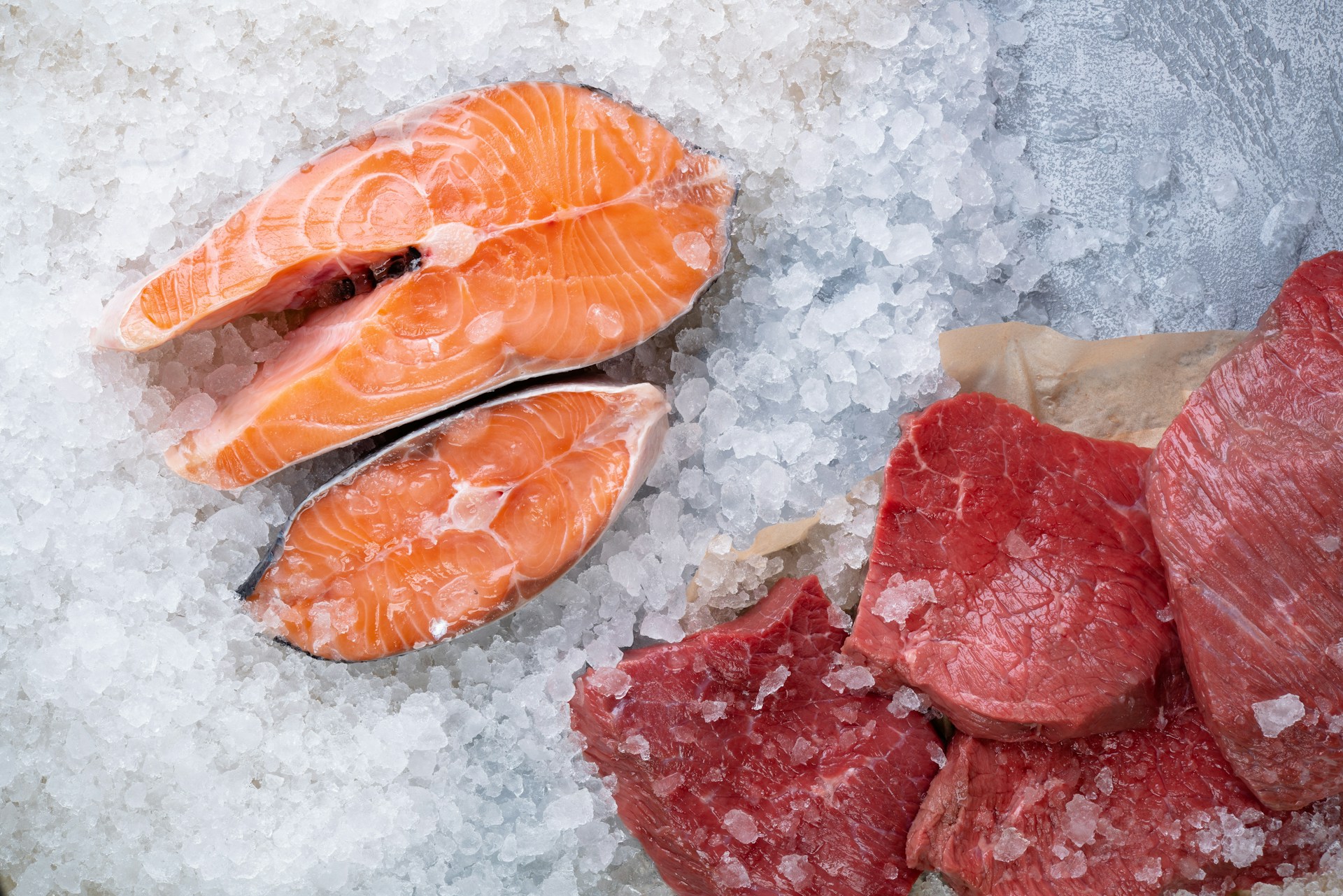 Photograph of meat and fish on ice