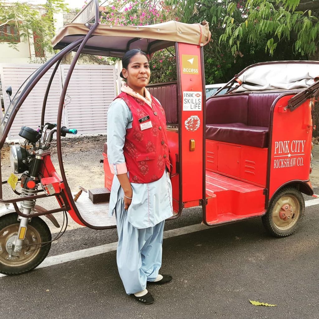 A Pink City Rickshaw employee