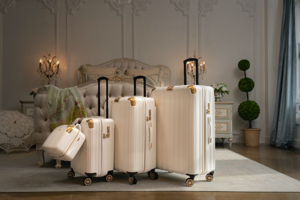 Three white suitcases