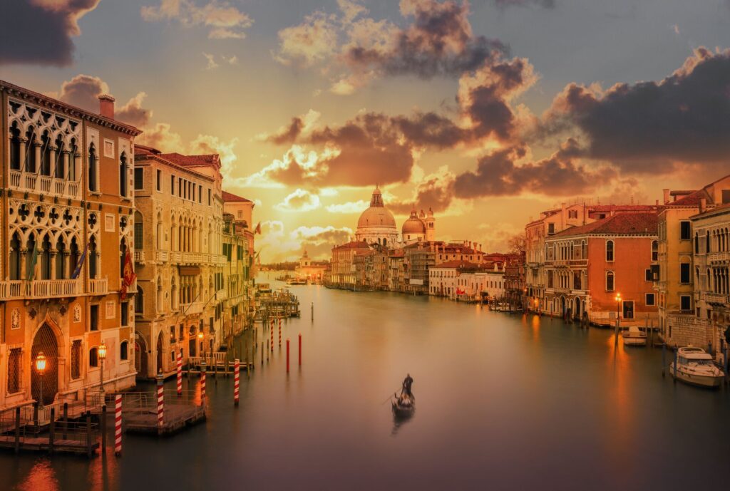 Gondola in the Grand Canal at sunset in Venice