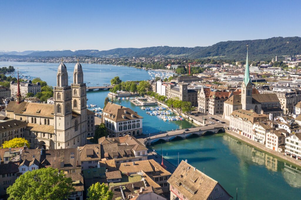 Aerial shot of Zurich, switzerland showing the cathedral and the lake