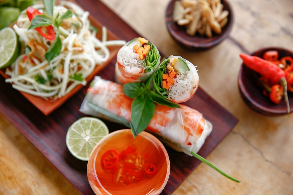 Image of Vietnamese spring rolls and noodles, shot from above