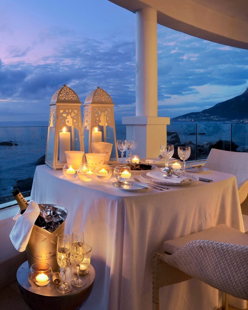 Photo of a restaurant table at 12 Apostles Hotel, dressed with candles and overlooking the ocean