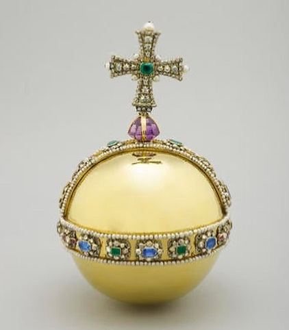 Image of the Sovereign’s Orb, a gold orb with a bejewelled cross and ornate jewel decoration. One of the objects used during the Coronation of a British monarch