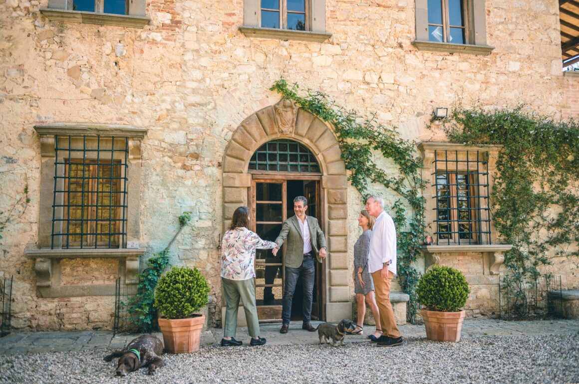 Image of Marchese Francesco Mazzei greeting guests outside his family home in Tuscany