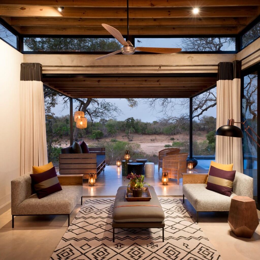 Image of luxury treehouse at Lion Sands game Reserve with plush furnishings and the bushland in the background
