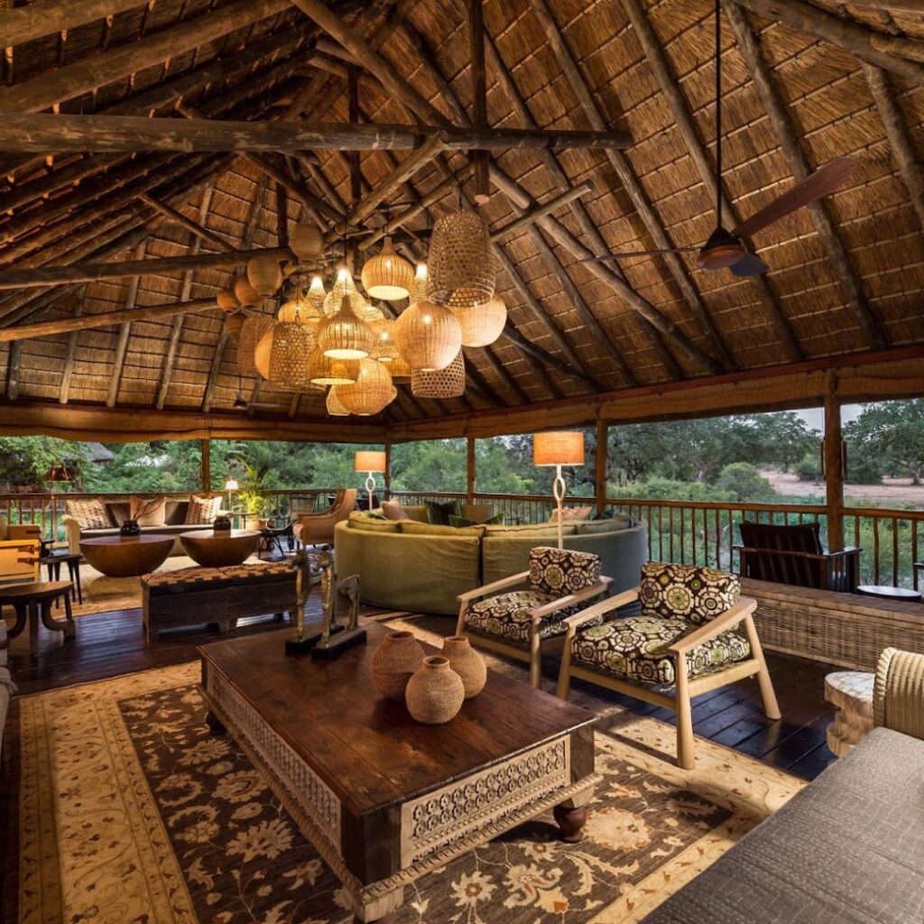 Image of a safari lounge with traditional tables and chairs and luxurious furnishings in natural colours