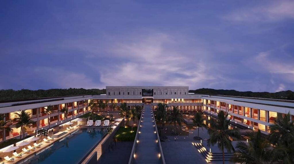 InterContinental Chennai Mahabalipuram Resort courtyard lit up with lamps at night, with the sea in the background