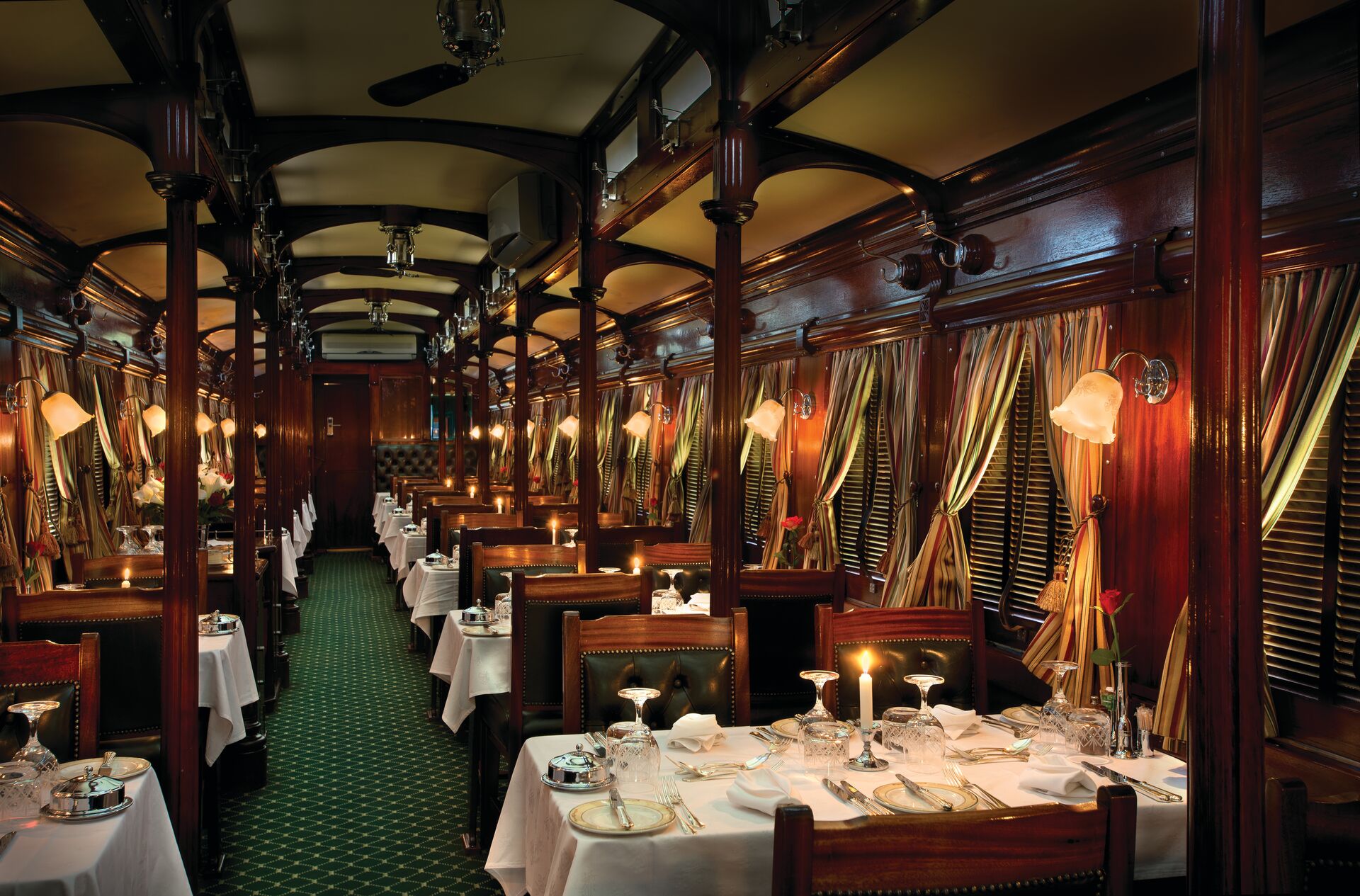 An opulent dining car on the Rovos Rail train