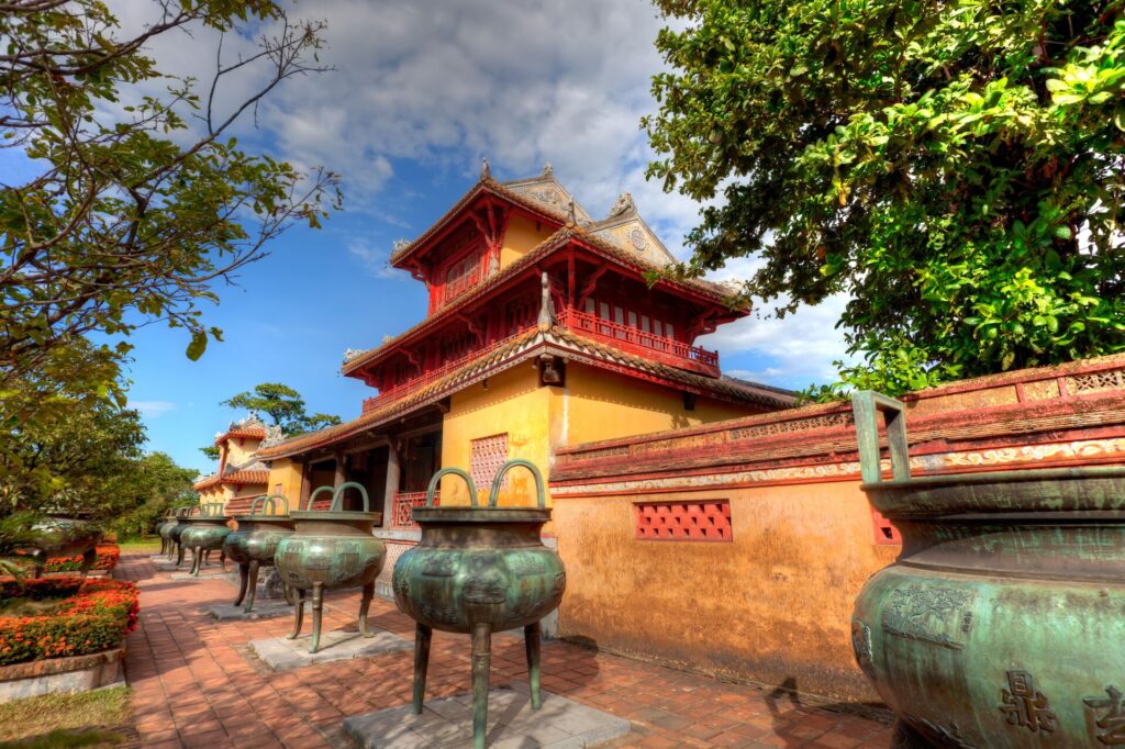 The Imperial Citadel of Hue, with its yellow and red brick and green urns in front
