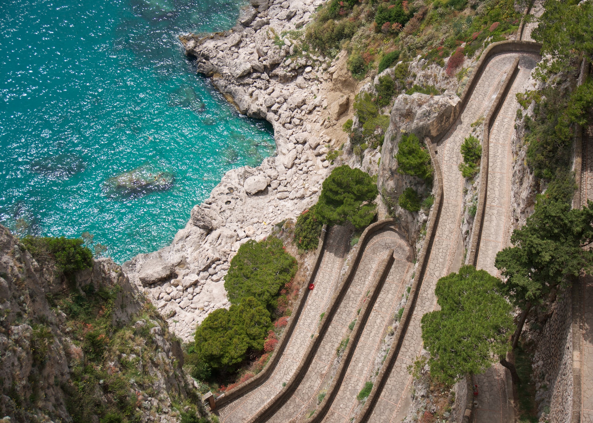 Narrow winding pathway down to the shore on Capri, Italy