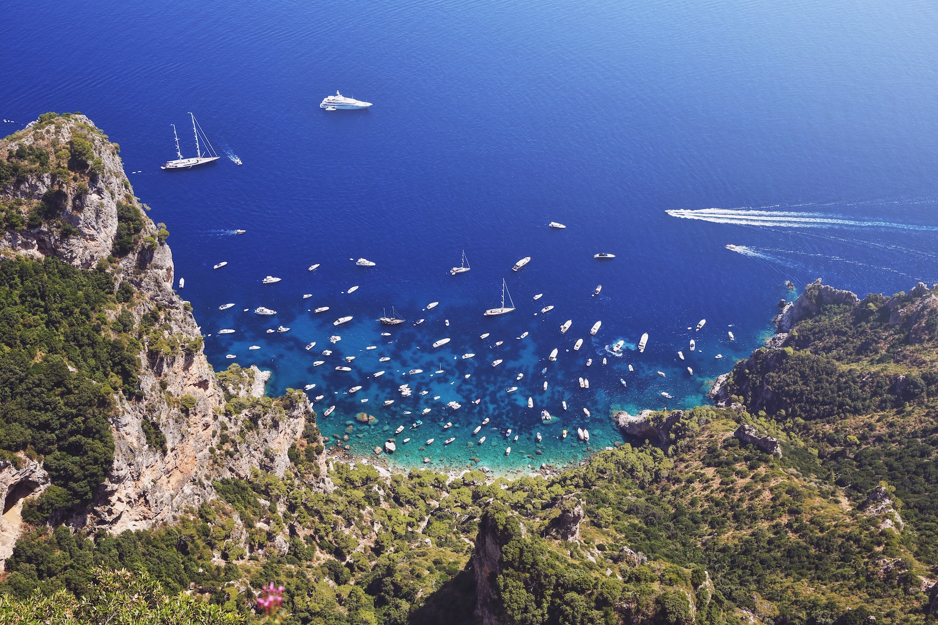 View overlooking boats and yachts anchored in a bay on Capri, Italy 