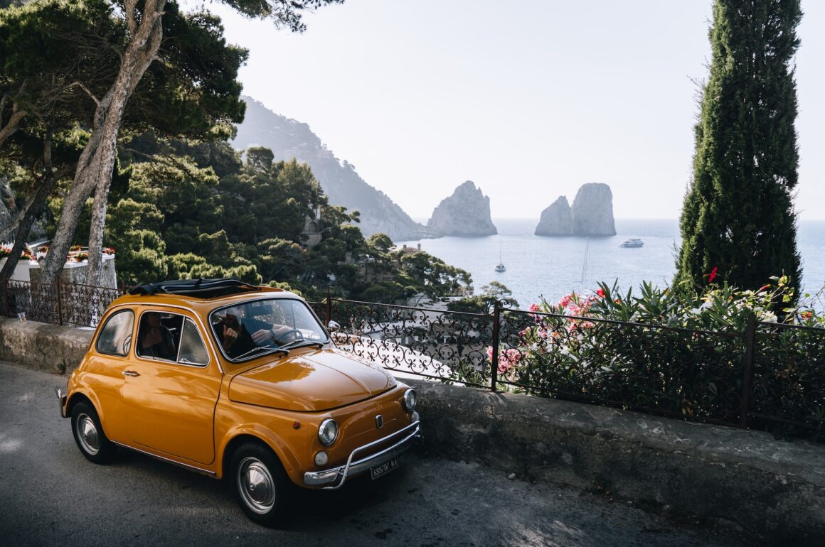 Vintage Fiat 500 parked overlooking Capri's coastline