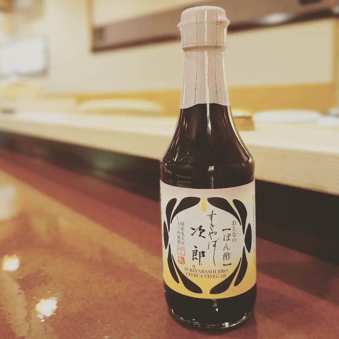 Bottle of Sukiyabashi Jiro citrus vinegar on table