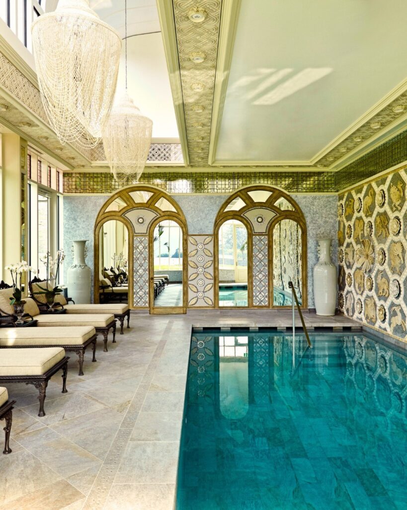 A blue plunge pool, cream marble floors and sumptuous couches of the spa at Ashford Castle