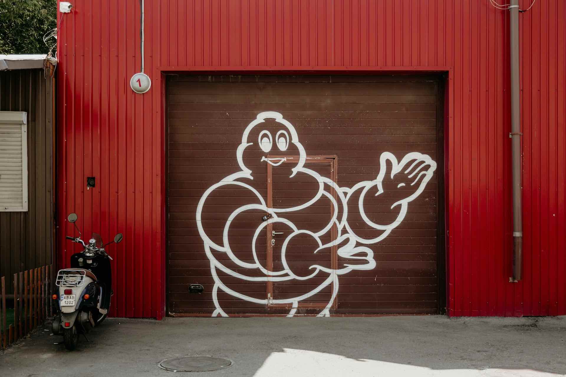 Michelin man spray painted on to a garage 