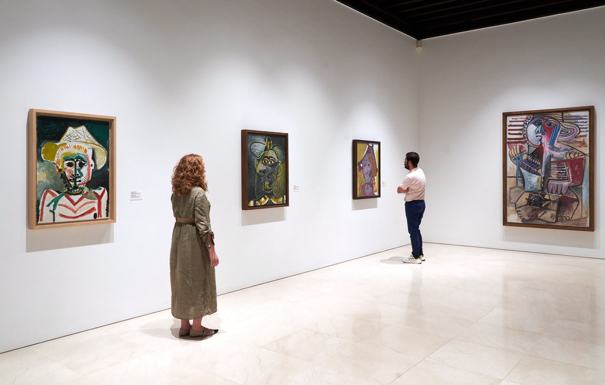 Mand and woman viewing artwork in the Picasso Museum, Malaga