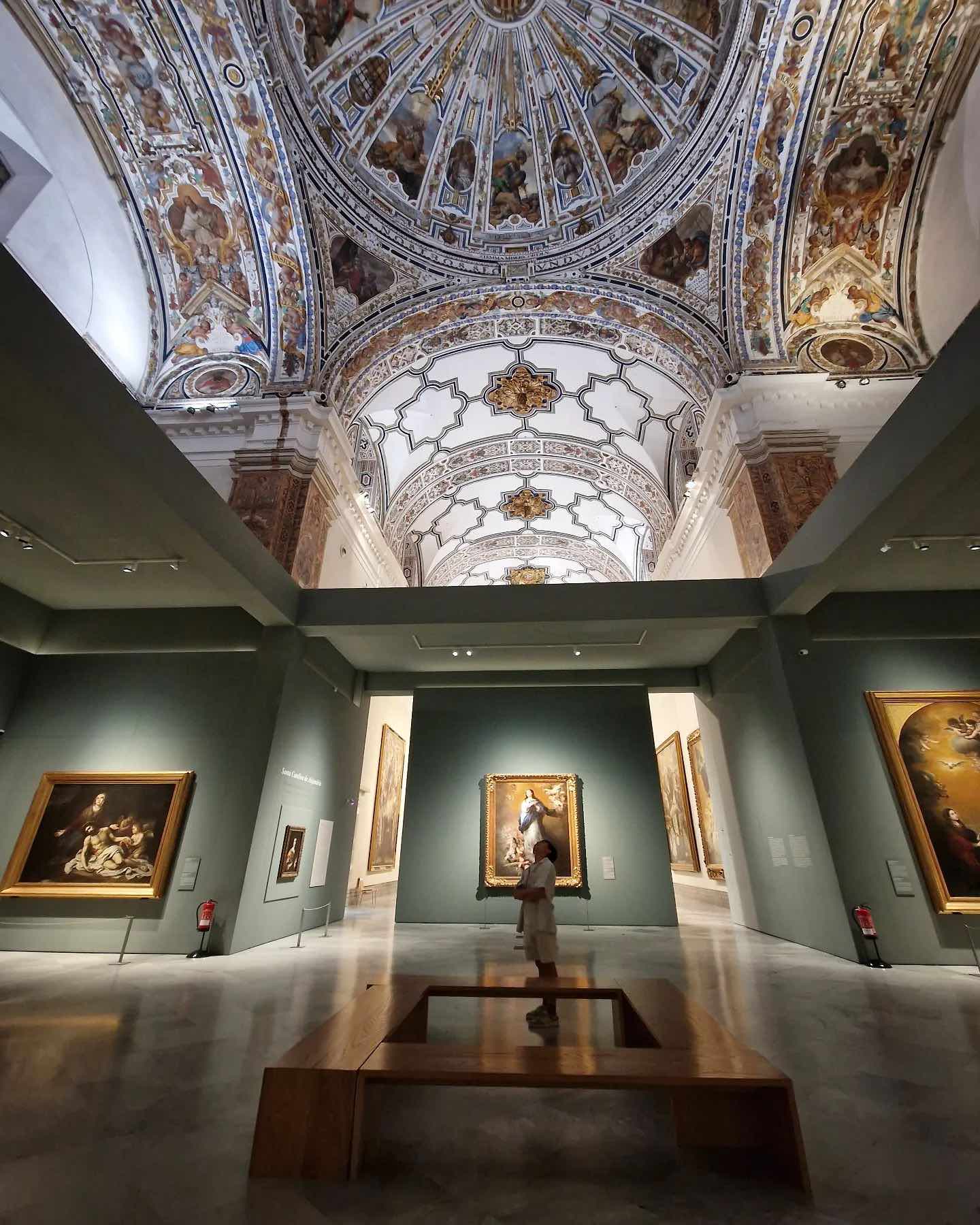 Interior gallery at the Museum of Fine Arts with decorative ceiling in Madrid