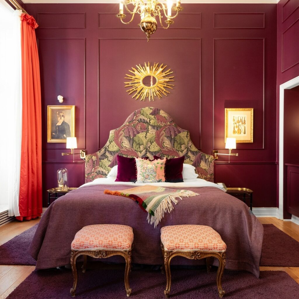 Interior of luxury hotel room with bed at the Grand Hotel Oslo, Norway