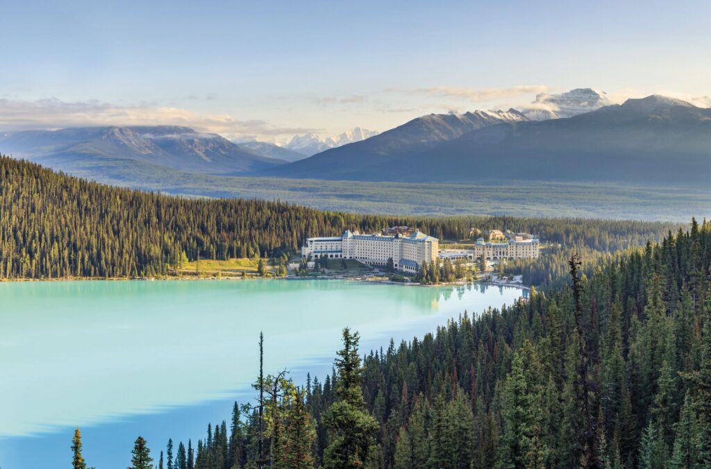 The Fairmont Chateau Lake Louise, photographed from high up on a hill. 