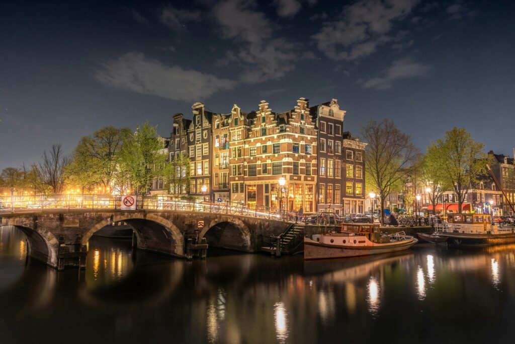 Amsterdam canals, photographed at night with light reflections on the water