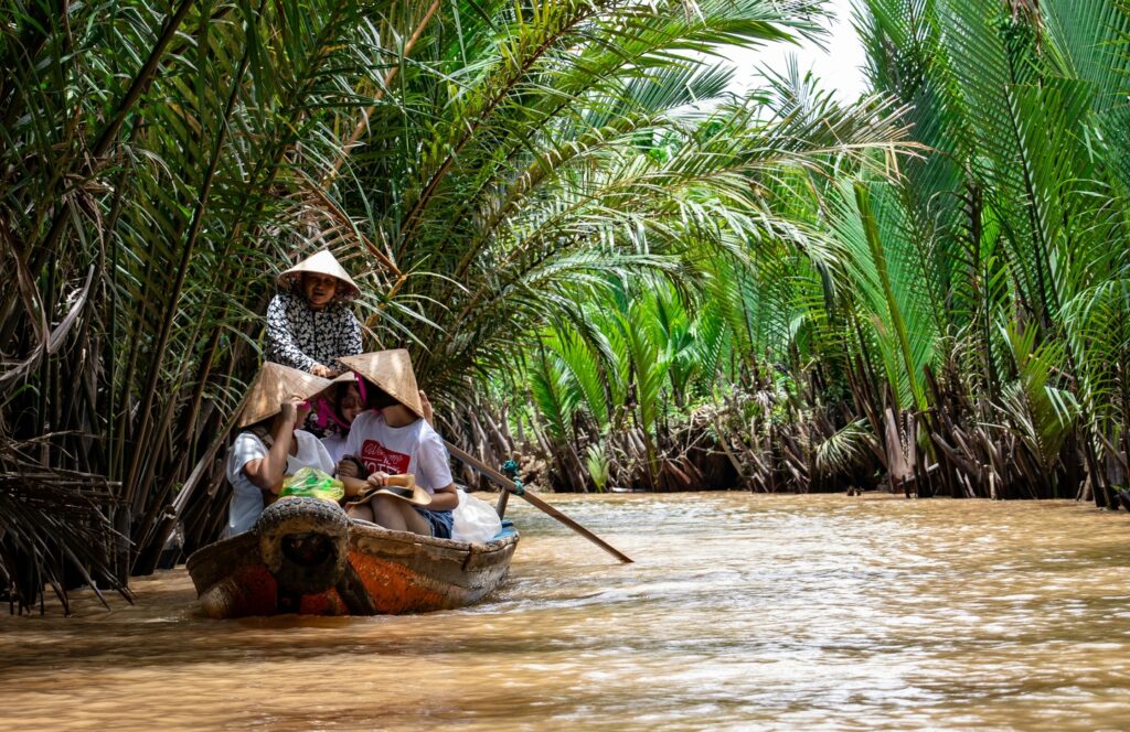 people sailing on Mekong River